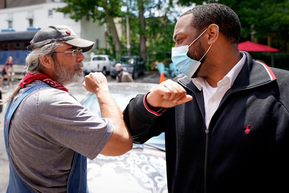 State Rep. Charles Booker campaigns on Election Day in Kentucky's Democratic primary for Senate in Louisville on June 23. (Bryan Woolston / Reuters)