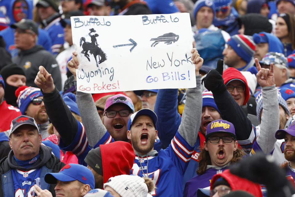 Buffalo Bills fans cheers and display a placard in the second half of an NFL football game against the Minnesota Vikings, Sunday, Nov. 13, 2022, in Orchard Park, N.Y. (AP Photo/Jeffrey T. Barnes)
