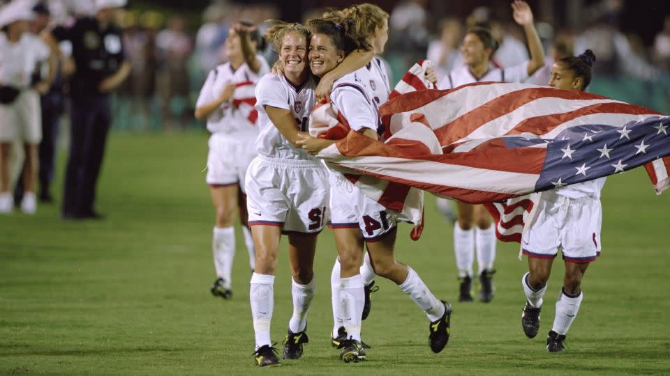 The players celebrate winning Olympic gold in 1996. - David Cannon/Allsport/Getty Images