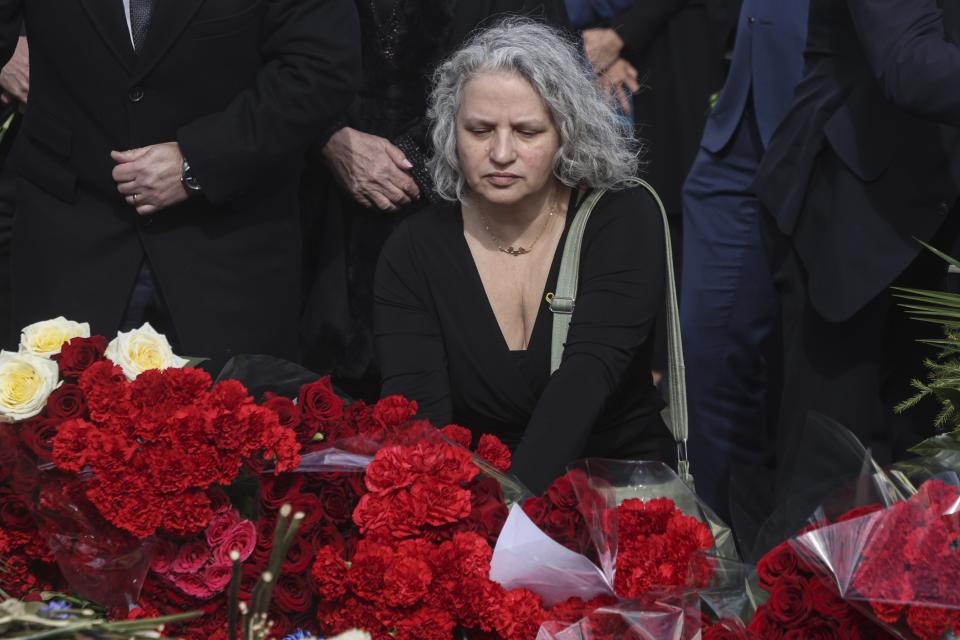 Israeli Ambassador to Russia Simona Halperin, with other ambassadors of foreign diplomatic missions, attends a laying ceremony at a makeshift memorial in front of the Crocus City Hall on the western outskirts of Moscow, Russia, Saturday, March 30, 2024. (Sergei Ilnitsky/Pool Photo via AP)