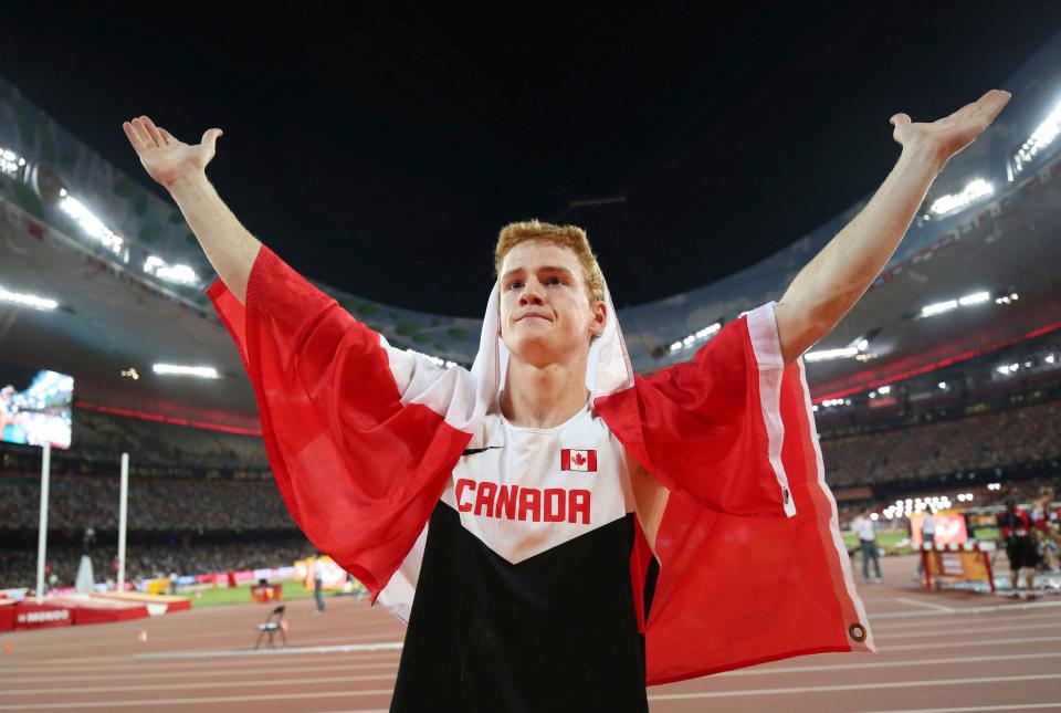 Canada's Shawn Barber celebrates after winning the gold medal in the men's pole vault final at the World Athletics Championships at the Bird's Nest stadium in Beijing on Aug. 24, 2015.