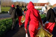 Migrants leave Sangatte community centre northern France