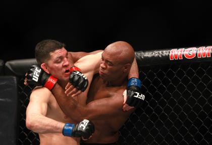Nick Diaz and Anderson Silva grapple during their fight at UFC 183. (Getty)