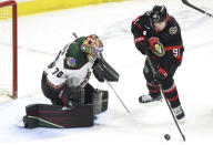 Ottawa Senators' Vladimir Tarasenko (91) tries to score on Arizona Coyotes goaltender Karel Vejmelka (70) during the first period of an NHL hockey game Friday, March 1, 2024, in Ottawa, Ontario. (Patrick Doyle/The Canadian Press via AP)