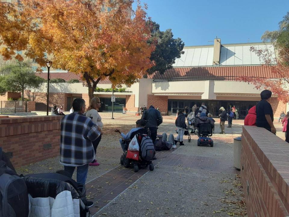 People line up outside Modesto Centre Plaza about 45 minutes before they would be seated for the Thanksgiving meal on Thursday, Nov. 24, 2022. This was the first meal since 2019 because of the pandemic and the number of people lined up was smaller than previous years.