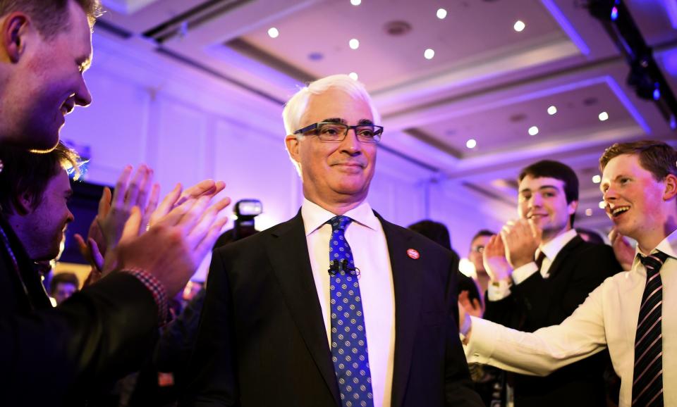 Supporters from the "No" Campaign applaud Alistair Darling, the leader of the Better Together campaign, at their headquarters in Glasgow, Scotland