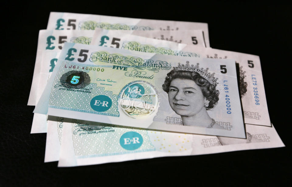 Samples of Polymer five pound banknotes are shown during the news conference at the Bank of England in London during a consultation on plans to issue plastic bank notes within the next three years.