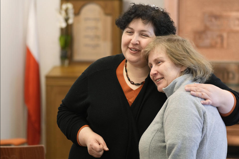 Rabbi Julia Gris, left, who led a Progressive Jewish congregation in Odesa, Ukraine, hugs a member of her congregation, Tatyana Kovalenko, at a synagogue in Warsaw, Poland, on Saturday, March 12, 2022. Many Jews are among the the hundreds of thousands of refugees leaving Ukraine. International Jewish organizations have mobilized to help, working with local Jewish communities in Poland, Romania, Moldova and elsewhere to organize food, shelter, medical care and other assistance. Among them is Rabbi Gris, Ukraine's only woman rabbi, who these days leads online Shabbat services for her scattered congregation. (AP Photo/Czarek Sokolowski)