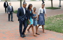 U.S. President Barack Obama, Malia Obama, Sasha Obama, and first lady Michelle Obama walk from the White House to St. John's Episcopal Church August 19, 2012 in Washington, DC. Obama is embroiled in an election race with Republican presidential candidate, former Massachusetts Gov. Mitt Romney. (Photo by Dennis Brack-Pool/Getty Images)