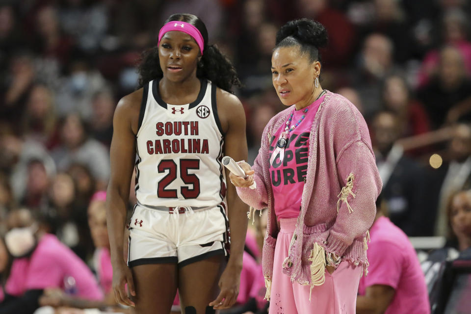South Carolina head coach Dawn Staley talks to guard Raven Johnson (25) during the first half of an NCAA college basketball game against Mississippi Sunday, Feb. 4, 2024, in Columbia, S.C. (AP Photo/Artie Walker Jr.)