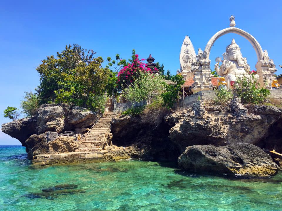 This Ganesha statue (a nelephant-headed son of Shiva) is situated above the blue-green waters. Source: Deborah Dickson-Smith