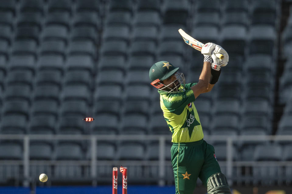 Pakistan's captain Babar Azam is bowled out by South Africa's bowler Sisanda Magala for 50 runs during the second T20 cricket match between South Africa and Pakistan at the Wanderers stadium in Johannesburg, South Africa, Monday, April 12, 2021. (AP Photo/Themba Hadebe)