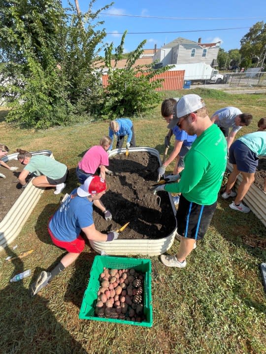 Tapestry Farms volunteers work at one of the urban farm locations in the QC area.