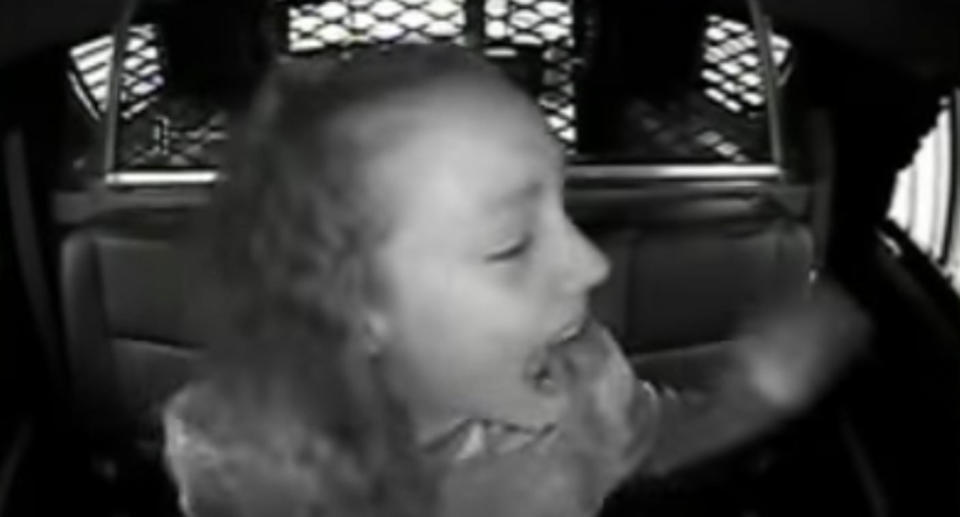 Mr Kovach’s daughter, Katlyn, screams from the backseat of his patrol car. Source: YouTube/ The Chronicle Telegram