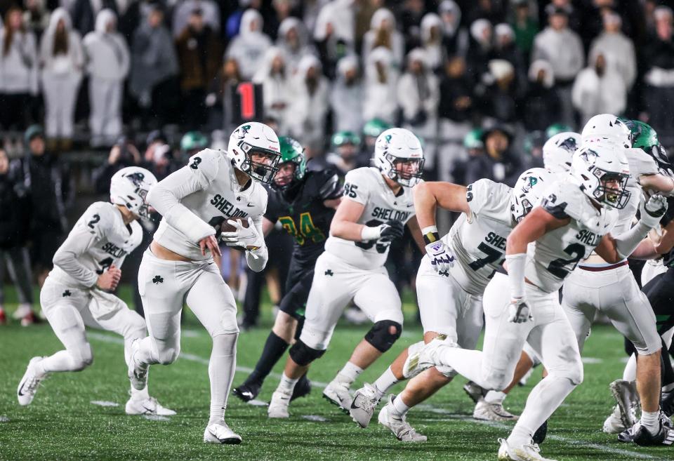 Sheldon's Teitum Tuioti (3) runs the ball in the 6A OSAA State Championship game against West Linn on Friday, Nov. 25, 2022 at Hillsboro Stadium in Hillsboro, Ore. 