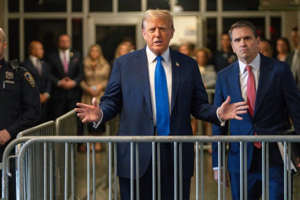 Trump speaking outside of court flanked by Blanche, who is one member of his legal team Steven Hirsch