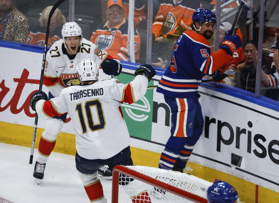 Florida Panthers' Vladimir Tarasenko (10) celebrates his goal with teammate Eetu Luostarinen (27) as Edmonton Oilers' Cody Ceci (5) reacts during the second period in Game 3 of the NHL hockey Stanley Cup Finals, Thursday, June 13, 2024, in Edmonton, Alberta. (Jeff McIntosh/The Canadian Press)