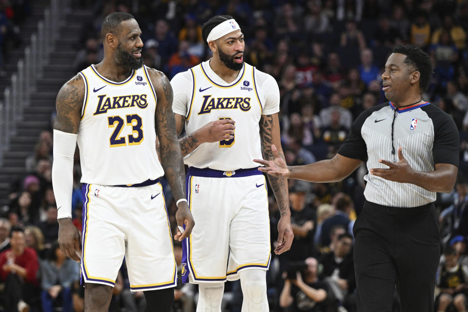 Los Angeles Lakers forward LeBron James (23) and forward Anthony Davis argue with a referee after a call during the second half of the team's NBA basketball game against the Golden State Warriors on Saturday, Jan. 27, 2024, in San Francisco. (AP Photo/Nic Coury)