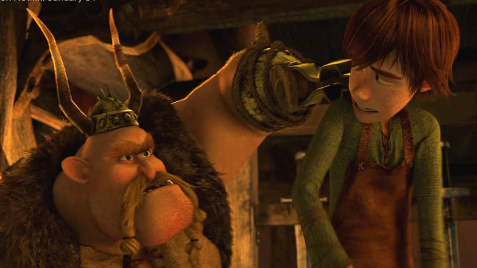 Gobber lifts Hiccup up as he reprimands him in How To Train Your Dragon.