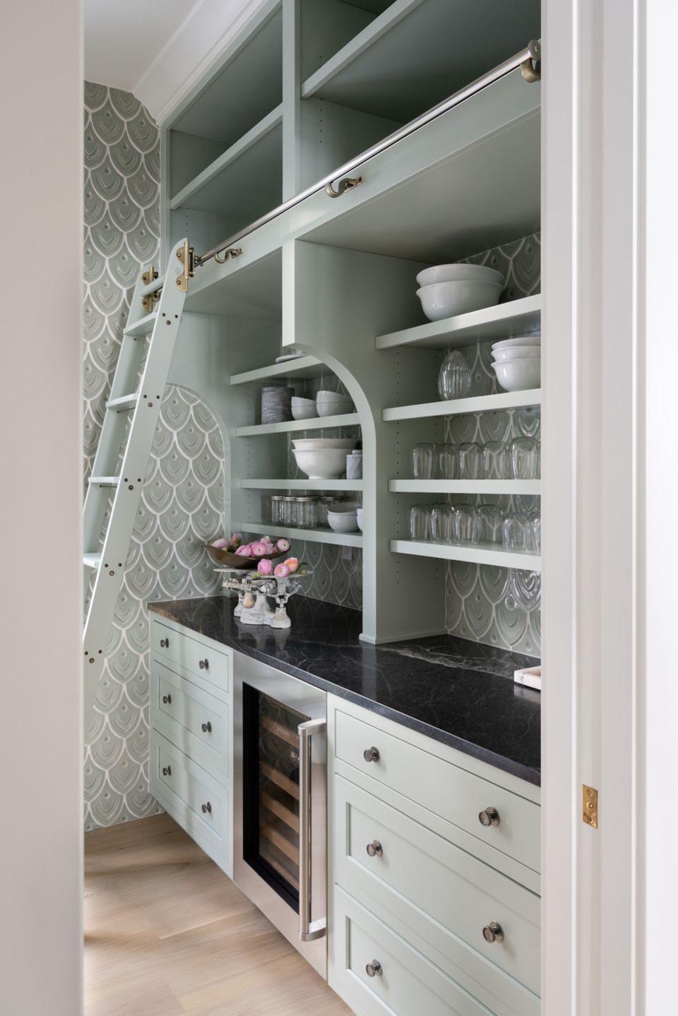 a kitchen with a glass cabinet