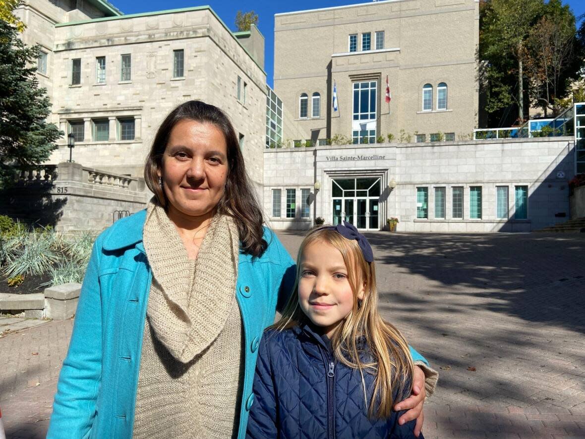 Nina Gonzalez Bychkova and her daughter Maya spoke with CBC News outside the school last week.   (Rowan Kennedy/CBC - image credit)