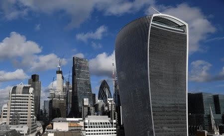 FILE PHOTO: The City of London financial district is seen with office skyscrapers commonly known as 'Cheesegrater', 'Gherkin' and 'Walkie Talkie' seen in London, Britain, January 25, 2018. REUTERS/Toby Melville