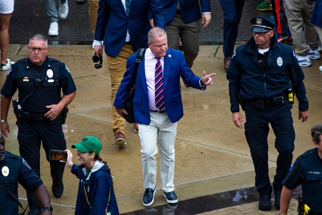 Notre Dame head coach Brian Kelly walks to the stadium before the Notre Dame vs. Cincinnati NCAA football game Saturday, Oct. 2, 2021 at Notre Dame Stadium in South Bend. 