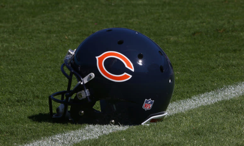 A Chicago Bears helmet sitting on the field.