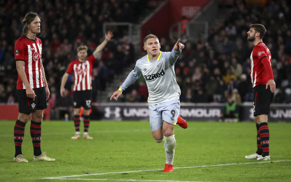 Derby County's Martyn Waghorn celebrates scoring his side's second goal of the game against Southampton, during their English FA Cup third round replay soccer match at St Mary's Stadium in Southampton, England, Wednesday Jan. 16, 2019. (Nick Potts/PA via AP)