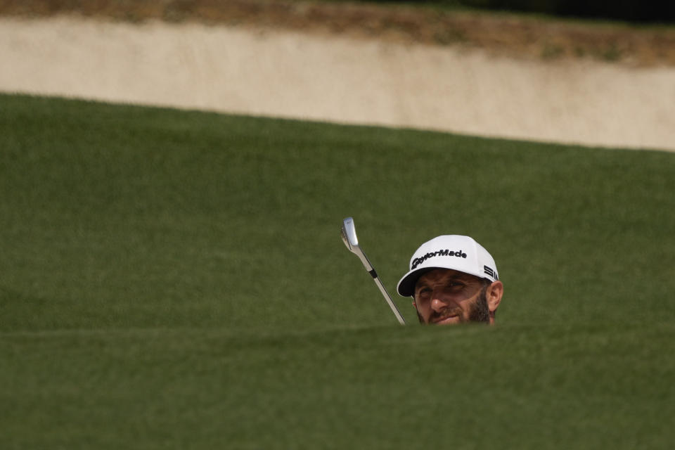 Dustin Johnson prepares to hit on the fifth hole during the first round of the Masters golf tournament on Thursday, April 8, 2021, in Augusta, Ga. (AP Photo/David J. Phillip)