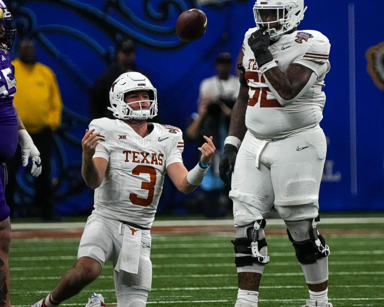 Texas quarterback Quinn Ewer throws the ball in frustration after being sacked Monday night. The Huskies got to Ewers twice, but the Longhorns didn't reach Washington's Michael Penix Jr. once.