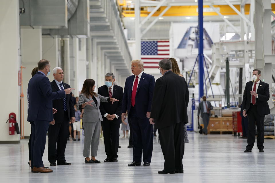 President Donald Trump and first lady Melania Trump participate in a tour of NASA facilities before viewing the SpaceX Demonstration Mission 2 Launch at Kennedy Space Center, Wednesday, May 27, 2020, in Cape Canaveral, Fla. (AP Photo/Evan Vucci)