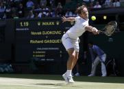 Richard Gasquet of France hits a shot during his match against Novak Djokovic of Serbia at the Wimbledon Tennis Championships in London, July 10, 2015. REUTERS/Adrian Dennis/Pool