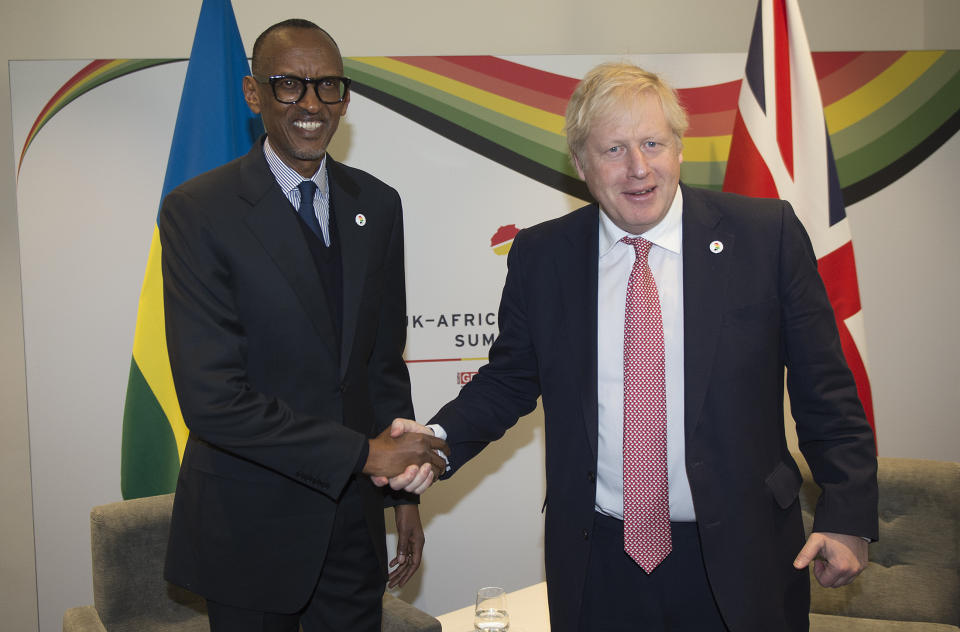 Britain's Prime Minister Boris Johnson, right, shakes hands with President of Rwanda Paul Kagame at the UK Africa Investment Summit in London, Monday Jan. 20, 2020. Boris Johnson is hosting 54 African heads of state or government in London. The move comes as the U.K. prepares for post-Brexit dealings with the world. (Eddie Mulholland/Pool via AP)