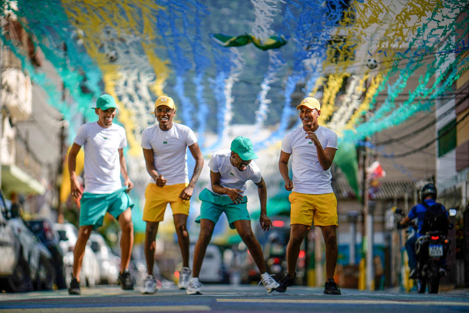Image: Funk music group Os Quebradeiras dance on a street decorated for the Qatar 2022 World Cup at Tijuca neighborhood, in Rio de Janeiro, Brazil, on Dec. 8, 2022. (Mauro Pimentel / AFP - Getty Images)