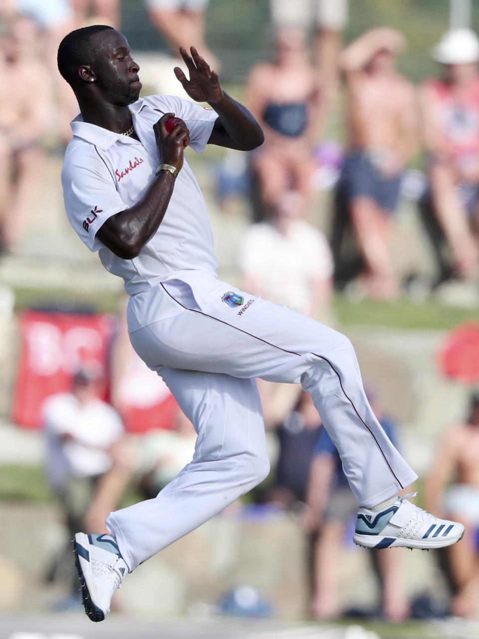 West Indies' Kemar Roach bowls against England during day one of the second Test cricket match at the Sir Vivian Richards Stadium in North Sound, Antigua and Barbuda, Thursday, Jan. 31, 2019. (AP Photo/Ricardo Mazalan)