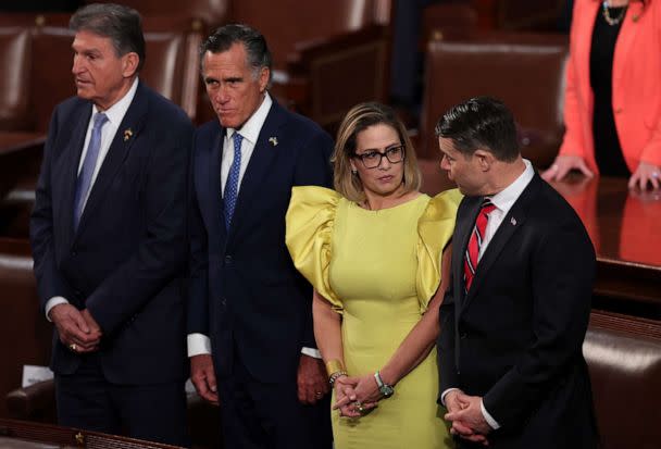 PHOTO: Sen. Joe Manchin, Sen. Mitt Romney, Sen. Kyrsten Sinema and Sen. Todd Young talk during U.S. President Joe Biden's State of the Union address, Feb. 7, 2023 in Washington. (Win Mcnamee/Getty Images)