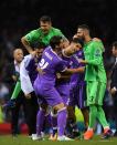 <p>Marco Asensio of Real Madrid celebrates scoring his sides fourth goal with his Real Madrid team mates during the UEFA Champions League Final between Juventus and Real Madrid at National Stadium of Wales </p>