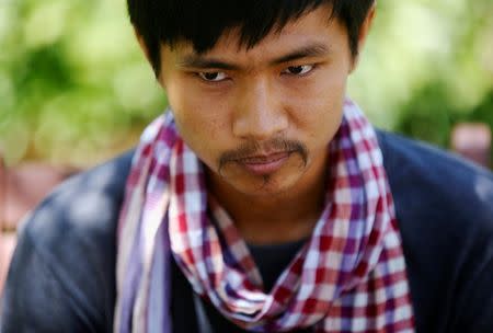 Ma Chetra 28, who runs the Social Breaking News (SBN) Pro-CNRP Facebook page, looks at during an interview with Reuters in Phnom Penh, Cambodia, July 3, 2018. Picture taken on July 3, 2018. REUTERS/Samrang Pring