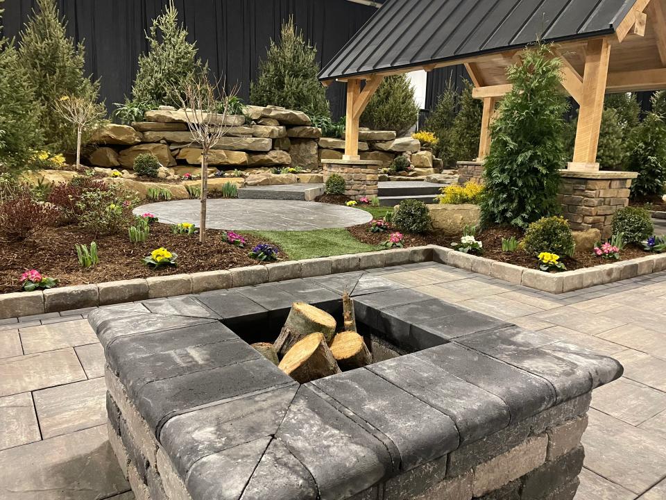 A firepit is part of Copley Township's Natural Falls Construction  "Unforgiven" showcase garden at the Great Big Home + Garden Show at the I-X Center in Cleveland.