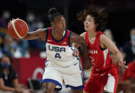 United States' Jewell Loyd (4), left, drives past Japan's Naho Miyoshi (12) during women's basketball preliminary round game at the 2020 Summer Olympics, Friday, July 30, 2021, in Saitama, Japan. (AP Photo/Eric Gay)