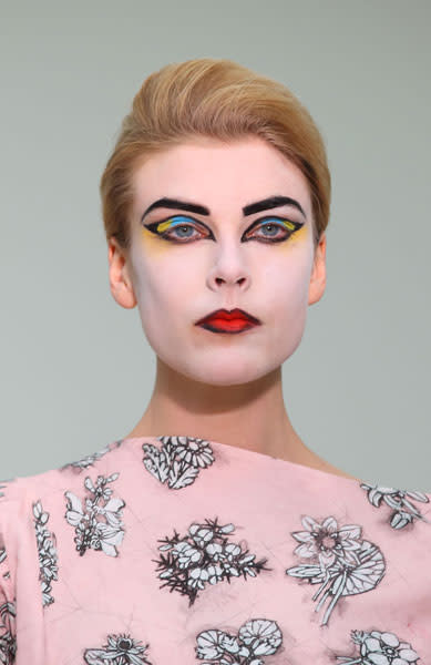 <b>Vivienne Westwood Red Label </b><br><br>Models' eyebrows were drawn in black and their lips were filled with pillarblock red lipstick and black lipliner.<br><br>Image © Getty