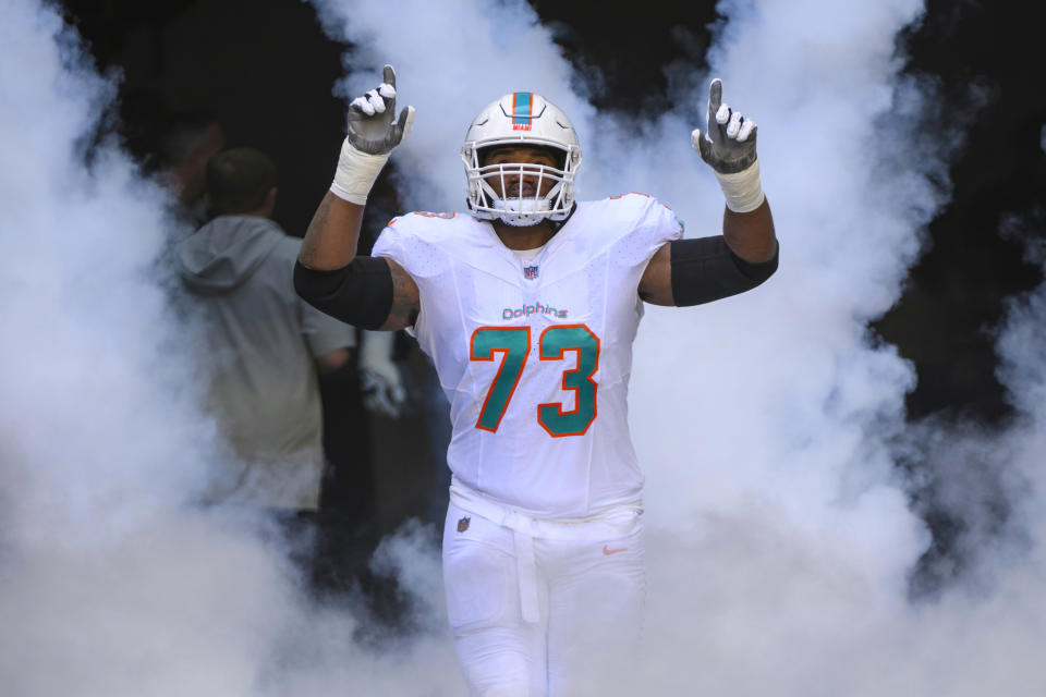 Miami Dolphins offensive lineman Austin Jackson (73) gestures as he runs onto the field during player introductions before an NFL football game against the Carolina Panthers, Sunday, Oct. 15, 2023, in Miami Gardens, Fla. (AP Photo/Doug Murray)