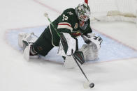 Minnesota Wild goalie Cam Talbot hits the puck away from the net during the third period in Game 3 of a first-round NHL hockey playoff series against Vegas Golden Knights, Thursday, May 20, 2021, in St. Paul, Minn. The Golden Knights won 5-2. (AP Photo/Stacy Bengs)