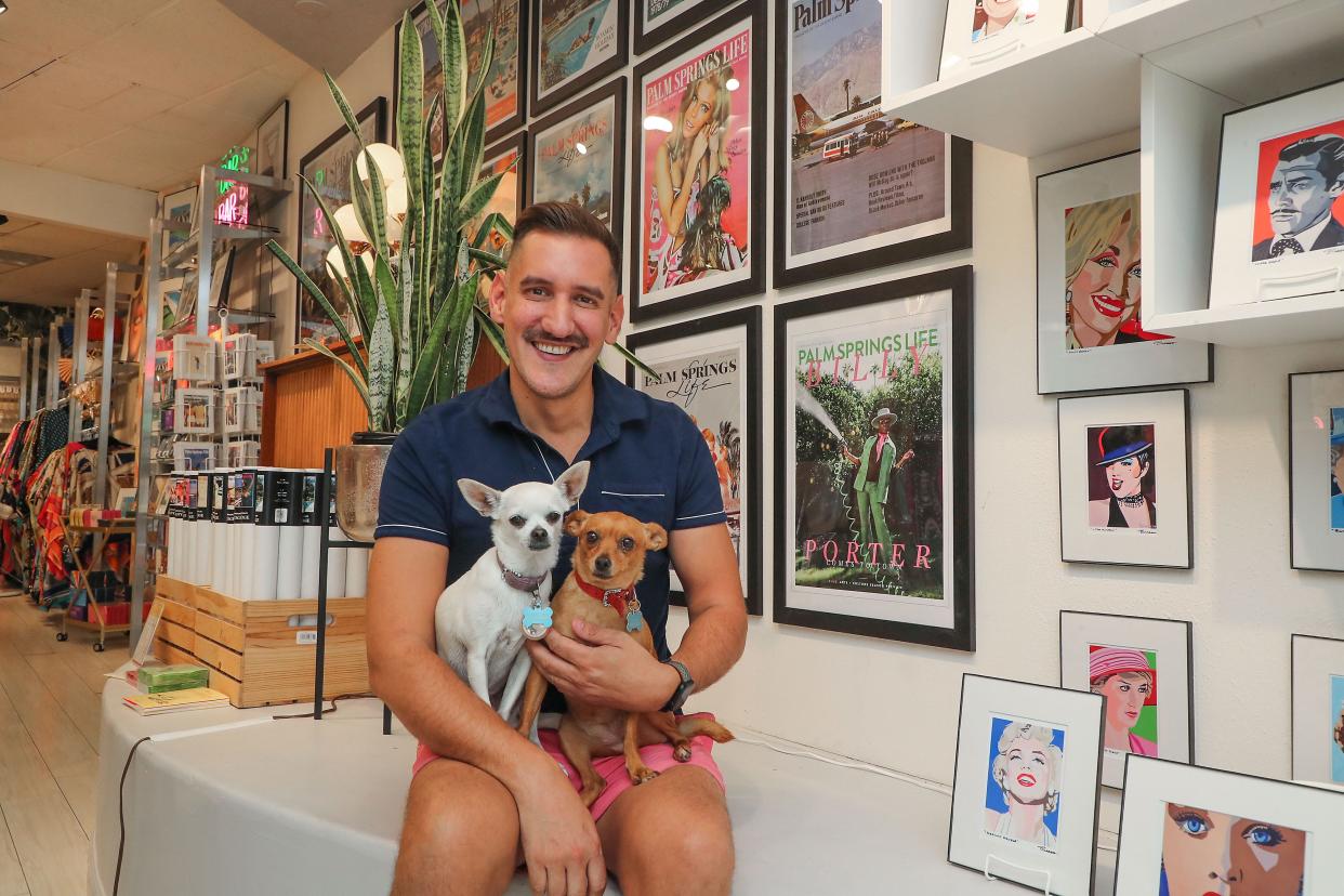 Jeff Witthuhn is the owner of LGBTQ-friendly gift store Peepa's in downtown Palm Springs, Calif., July 20, 2022.  He is pictured with his dogs Madeline, left, and Millie.