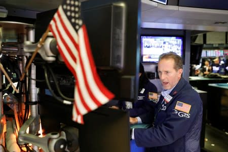 A trader works on the floor of the New York Stock Exchange shortly after the closing bell in New York