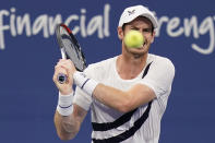 Andy Murray, of Great Britain, grimaces as he returns a shot during his match with Milos Raonic, of Canada, during the third round at the Western & Southern Open tennis tournament Tuesday, Aug. 25, 2020, in New York. (AP Photo/Frank Franklin II)