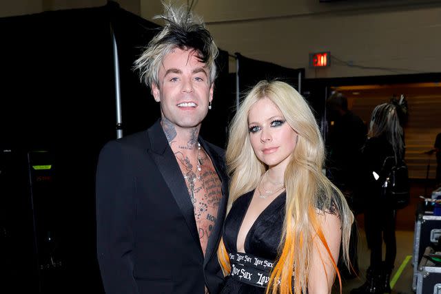 <p>Frazer Harrison/Getty</p> Avril Lavigne and Mod Sun at the Grammy Awards in Las Vegas in April 2022.