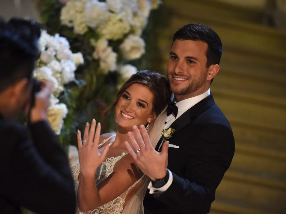 Jade Roper and Tanner Tolbert show off their rings during "The Bachelor at 20" special in 2016.