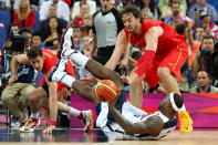 LONDON, ENGLAND - AUGUST 12: Pau Gasol #4 of Spain hussles for the ball against LeBron James #6 of the United States during the Men's Basketball gold medal game between the United States and Spain on Day 16 of the London 2012 Olympics Games at North Greenwich Arena on August 12, 2012 in London, England. (Photo by Christian Petersen/Getty Images)